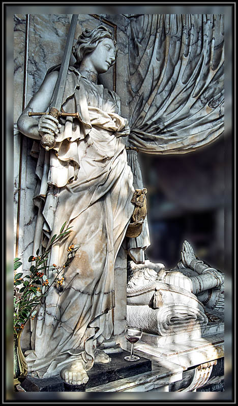 Glass of full boded red on the magnificent Monument of Sir Anthony Mildmay. St Leonards Church, Apethorpe, Northamptonshire, England.